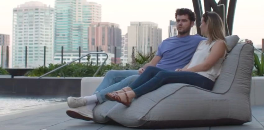 man and woman sitting on an ambient lounge twin avatar deluxe